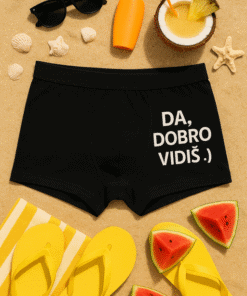 1. Sunscreen, sunglasses, i plavi šorc s natpisom, ljetni dodatci za odmor.